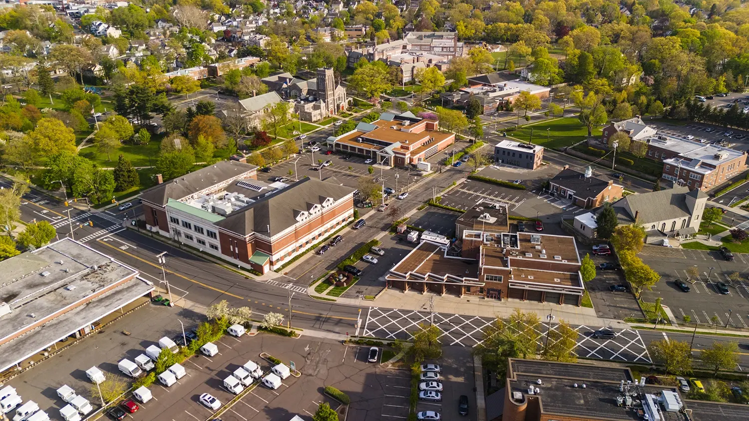 Aerial view of a multi-site commercial district with retail, restaurant, hospitality, and other business locations, representing the diverse environments Connext Advisory supports. Aerial view of a multi-site commercial district with retail, restaurant, hospitality, and other business locations, representing the diverse environments Connext Advisory supports.