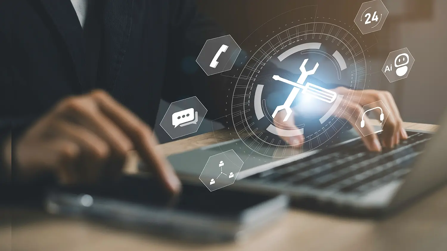 A professional typing on a laptop with a digital overlay of IT support icons — including phone, chat, headset, and AI — representing 24/7 enterprise user support services.
