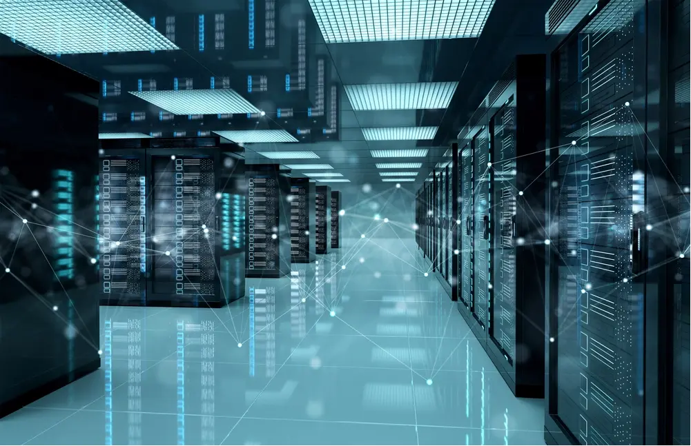 Modern enterprise data center with rows of network server racks and digital connectivity overlays representing centralized network operations, infrastructure monitoring, and multi-site enterprise connectivity. Modern enterprise data center with rows of network server racks and digital connectivity overlays representing centralized network operations, infrastructure monitoring, and multi-site enterprise connectivity.